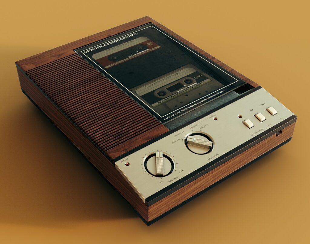 A vintage analogue answering machine from the 80's made of wood and chrome