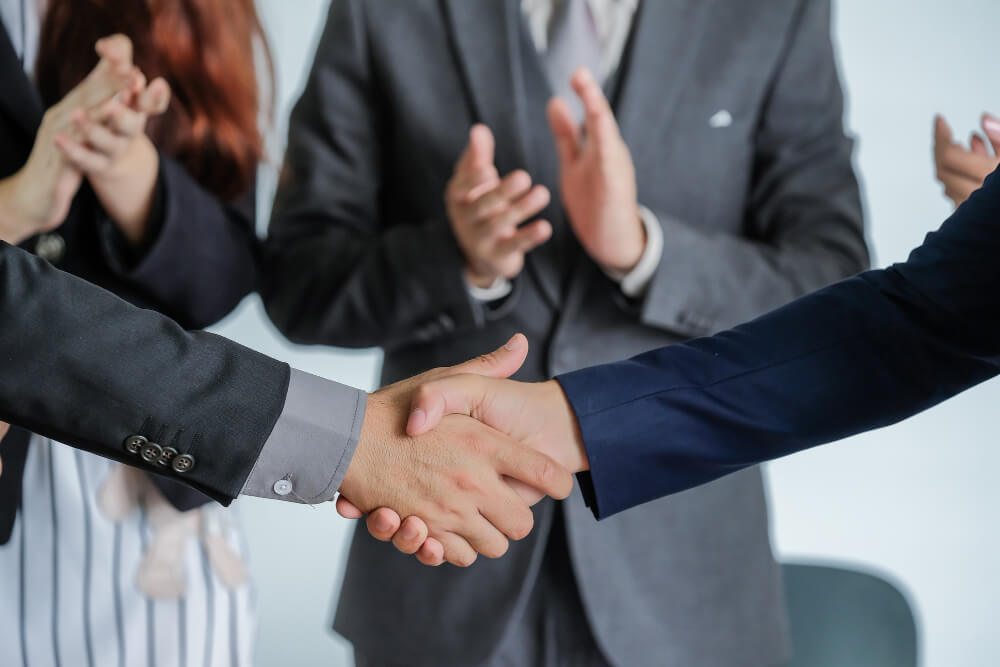 group-business-people-meeting-shaking-hands people shaking hands